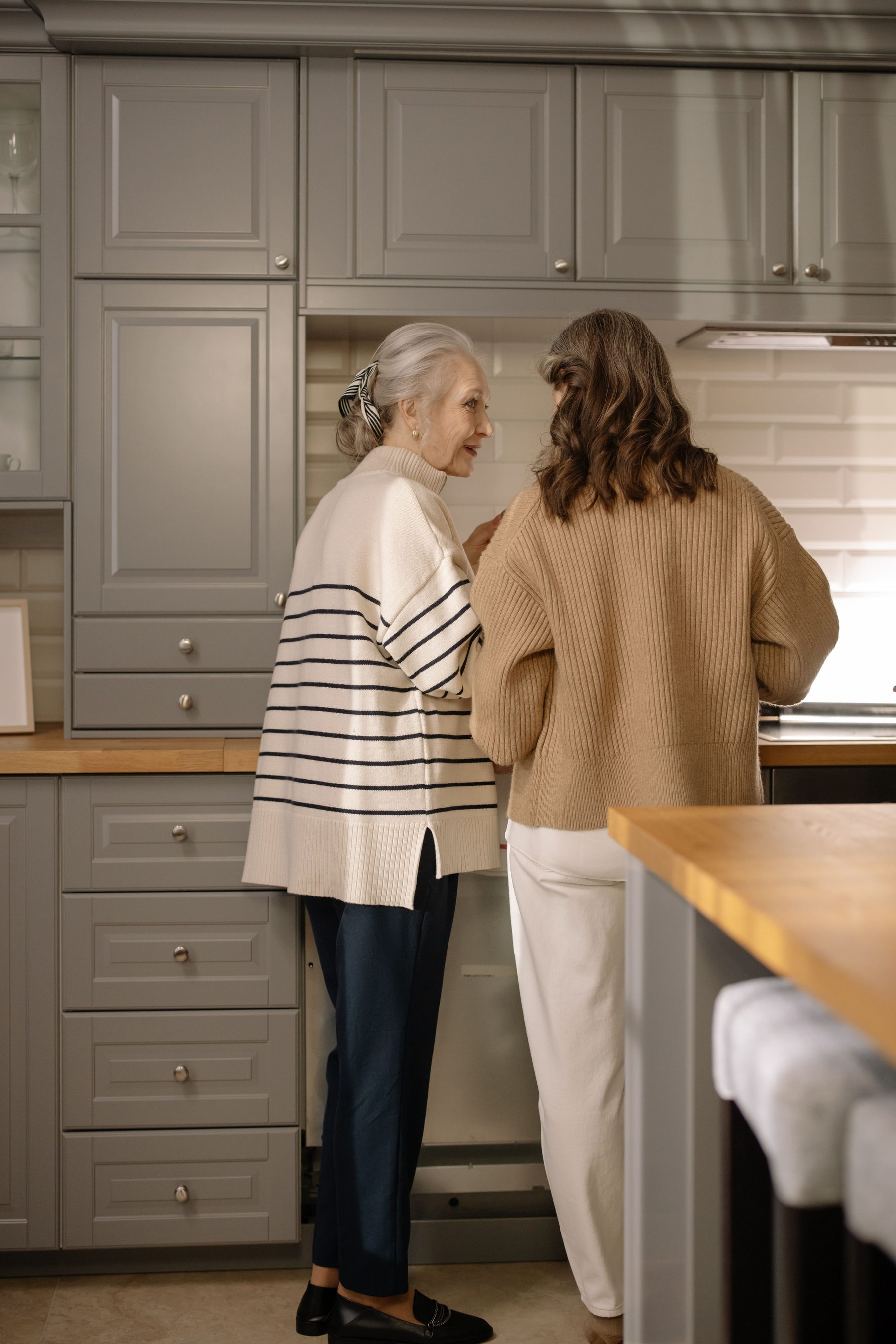 A carer and client preparing a meal together at home